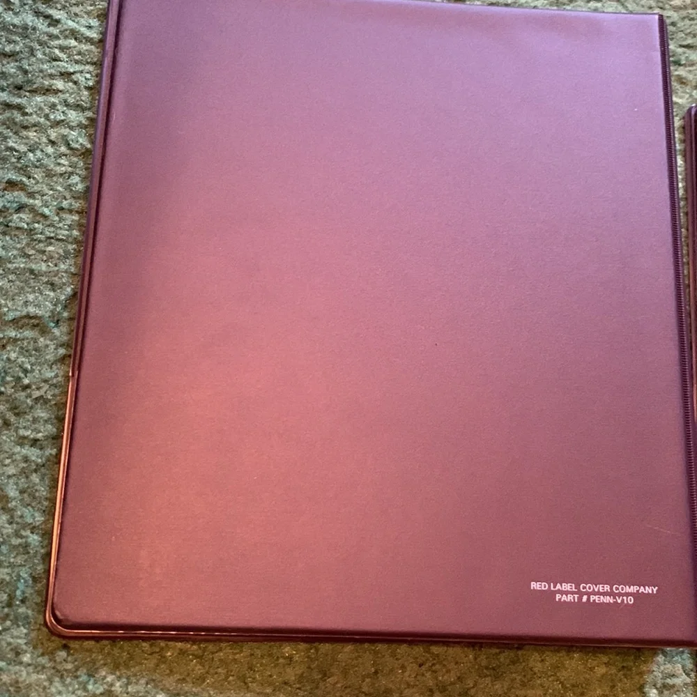 2 Penn state binders. Rough measurements in photos.
